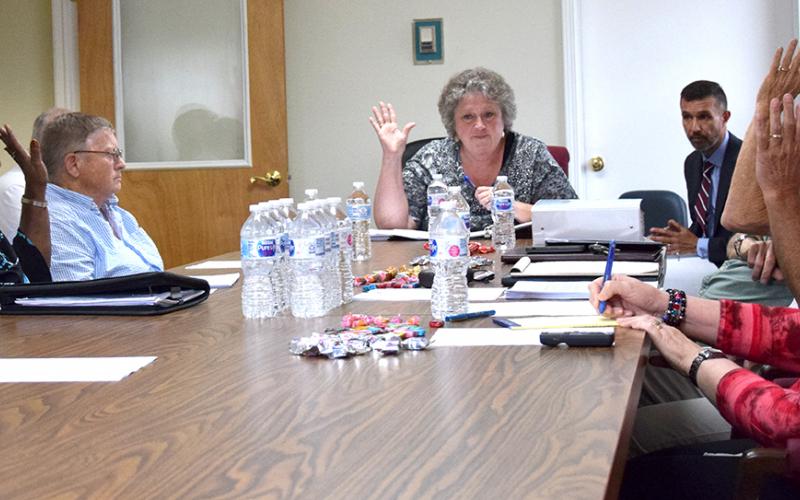 Members of the Franklin County Ethics Board – Joann Butler, Jackie Payne, Chairman Debra Grizzle, Michael O’Connell and Mark Herndon – vote Monday to dismiss a complaint filed by Daniele Weaver against county officials. (Photo by Scoggins)