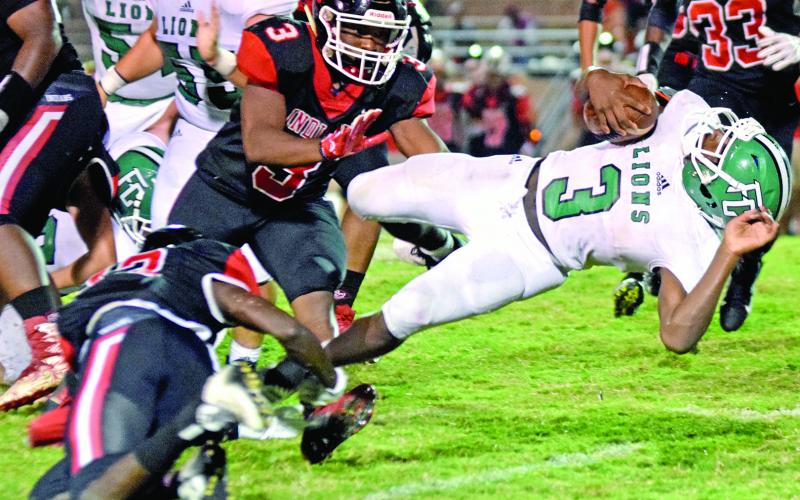 Lion back C.J. Hall dives for extra yards in action Friday at The Reservation in Toccoa. (Photos by Rose Scoggins)
