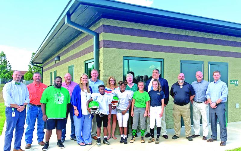Franklin County Middle School has a new field house. Pictured in front of the new building are FCMS Principal C.J. Wilder, Board of education member Alan Mitchell, FCMS Head Football Coach Jim Allen, BOE member Randall Gailey, FCMS Assistant Principal Kasey Haley, BOE member Eric Burrell, A.J. Elliott, Mylan Roebuck, MacCall Davis, Kenzleigh Fain, BOE member Jo Beth James, BOE member Robin Cato, Franklin County Schools Superintendent Chris Forrer, Assistant Superintendent Chuck Colquitt, Assistant Superinte