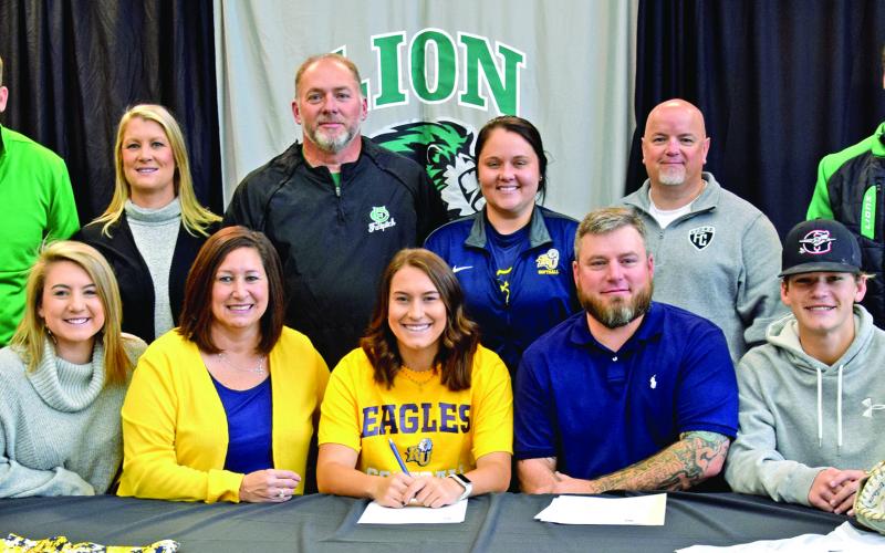 Pictured at Kalyn Jinks’ scholarship signing last week with Reinhardt University are (front, from left) sister Kylie Jinks, mother Vanessa Jinks, Kalyn Jinks, father  Brett Jinks, brother Kayne Jinks, (back) FCHS Basketball Coach John Strickland, Assistant Softball Coach Cherokee Bell, Softball Coach and Athletic Director Jason Oliver, Reinhardt Head Softball Coach Jade Geuther, FCHS Principal Roger Wilkinson and FCHS Tennis Coach Chuck Holland.