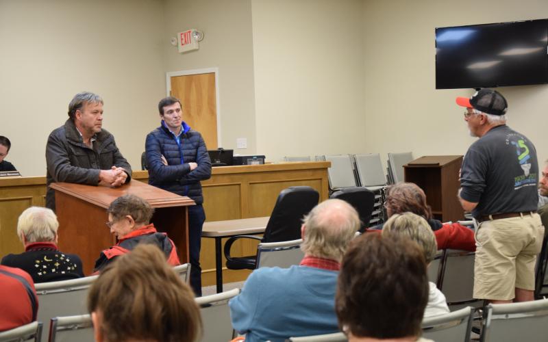 Rodney Black (right), who lives near the Georgia Renewable Power plant near Carnesville, tells GRP officials David Groves (right) and Ciaran McManus (center) about noise and smell problems at the plant during one of many Franklin County Commissioner meetings attended by the plant’s neighbors during the second half of 2019.