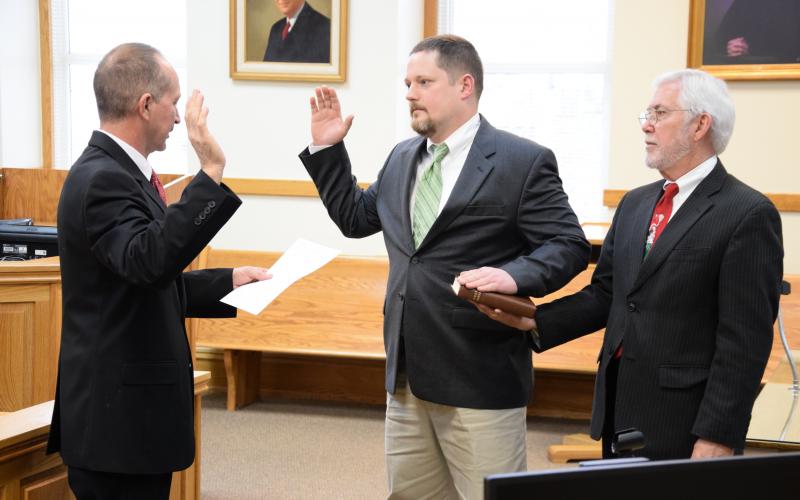 Commissioner Jason Macomson (center, during his swearing-in ceremony in 2017 as District 2 Commissioner) has announced he will run for chairman of the Franklin County Board of Commissioners.