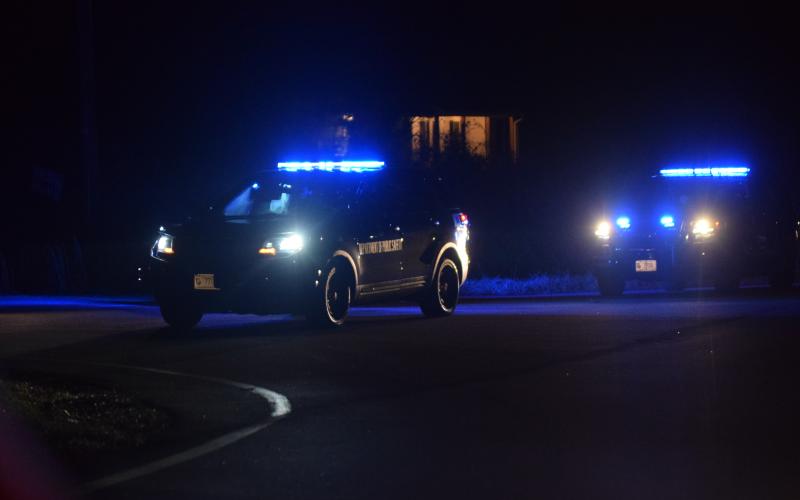 Law enforcement officers blocked off High Road in Carnesville Tuesday after a man threatened to blow up his home. The man was later injured when he did set off an explosion.