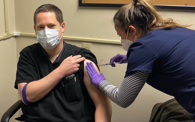 Jason Macomson gets vaccinated for the COVID-19 virus by a nurse at VitaLink Research in Anderson, S.C. Macomson and five other Franklin County residents took part in trials for the new Moderna coronavirus vaccine.
