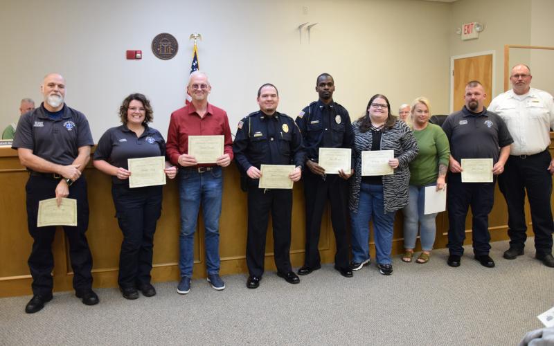 EMTs Jim Crisp, Amber King and John Bruce; First Responder David Gunter of the Gumlog Fire Department; Lavonia Police Officers Justin Parten and Jay Thomas; and dispatchers Brittany Keith and Jenny King were honored by EMS Director Terry Harris Tuesday for their help in saving the life of a patient in cardiac arrest in January.