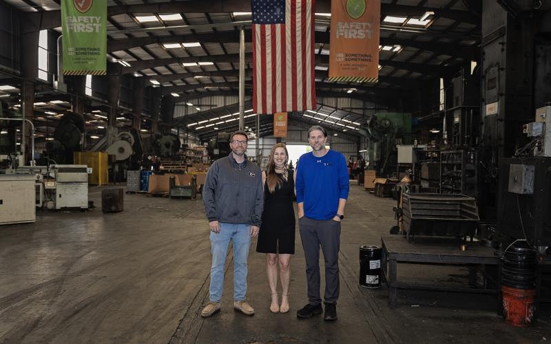 Tonya Powers of the Franklin County IBA (center) stands with Chase Watson and John White of Atlanta Rod in the company’s Lavonia plant. Atlanta Rod was recently honored by the State of Georgia and invited to a meeting at the White House in Washington, D.C.