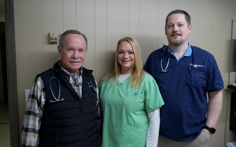 Dr. Patrick Hitchcock of Lavonia Animal Hospital is pictured with his two longest-serving staff members,  office manager Kimberly Watson and Dr. Jason Macomson