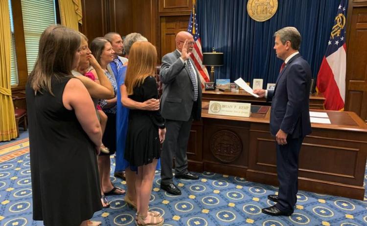 Lavonia Police Chief Bruce Carlisle is surrounded by family as he his sworn in as the Georgia Association of Chiefs of Police (GACP) representative on the Board of Public Safety by Gov. Brian Kemp on Aug. 29. Carlisle is serving a three-year term and was appointed to the position by both Gov. Nathan Deal and Gov. Kemp.