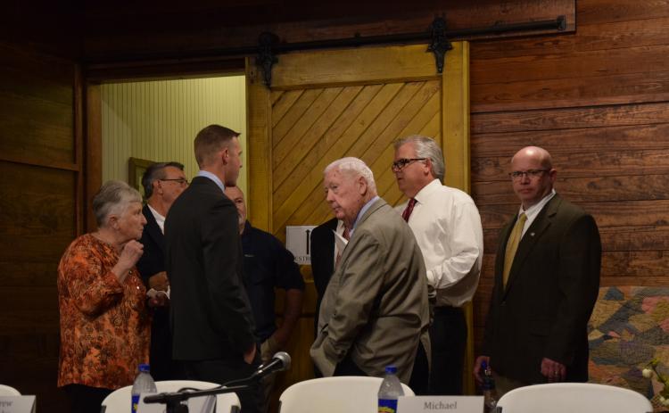 Candidates for Lavonia mayor and city council talk with moderator Bill Hogan (second from right) before Thursday's Lavonia Chamber of Commerce forum at the Lavonia Depot. (Photo by Scoggins)