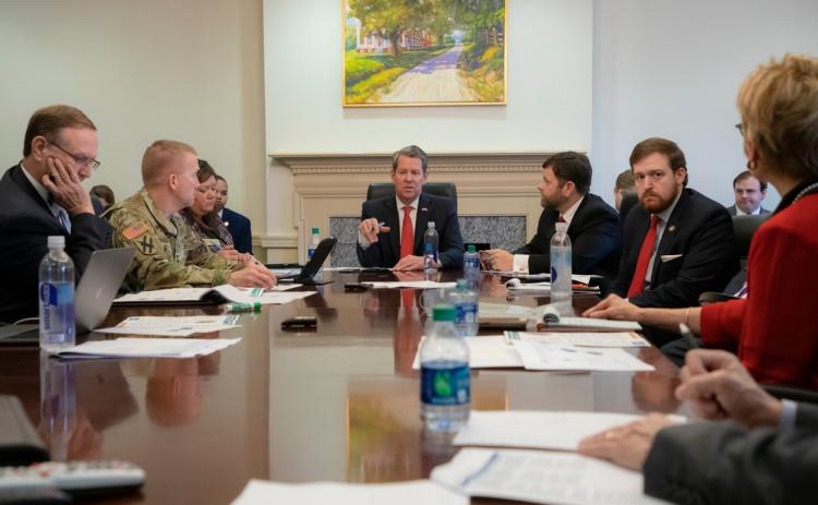 Georgia Gov. Brian Kemp (center) meets with his Coronavirus Task Force. The governor issued a shelter-in-place order Thursday afternoon.