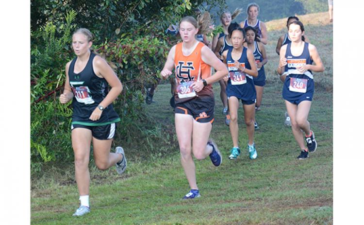 Kadyn Crowe leads a pack of runners during Saturday’s varsity girls race. (Photo by Scoggins)