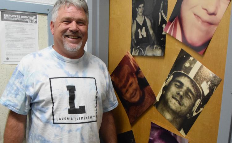 The faculty at Lavonia Elementary School decorated the office door of retiring Principal Brad Roberts with photos from his past. (Photo by Scoggins)