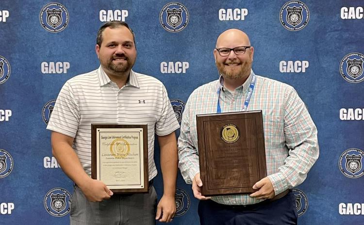 Lt. Wayne Mitchum (left) and Deputy Chief Daniel Carson (right) received the Lavonia Police Department’s State Certification recently during the Georgia Association of Chiefs of Police Summer Conference in Savannah. 