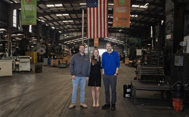 Tonya Powers of the Franklin County IBA (center) stands with Chase Watson and John White of Atlanta Rod in the company’s Lavonia plant. Atlanta Rod was recently honored by the State of Georgia and invited to a meeting at the White House in Washington, D.C.