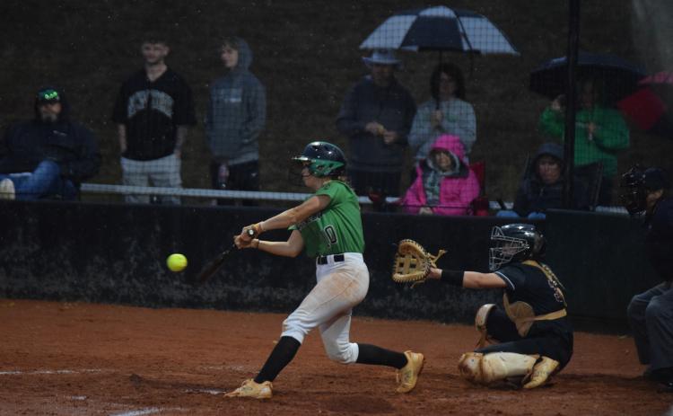 Keely Emmons gets a hit during a rainy Region 8AAA championship-deciding game last week against Hebron Christian Academy. (Photo by Scoggins)