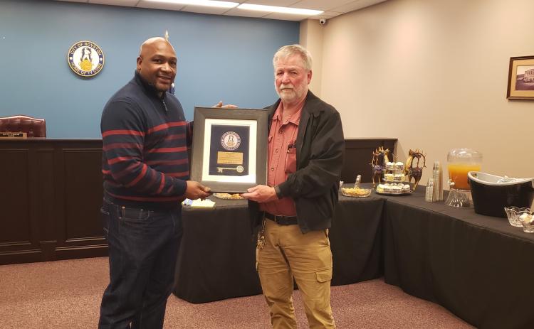 Wayne Braswell and Lee Strickland were presented plaques to commemorate their service on the city council by Mayor Keith Turman. 