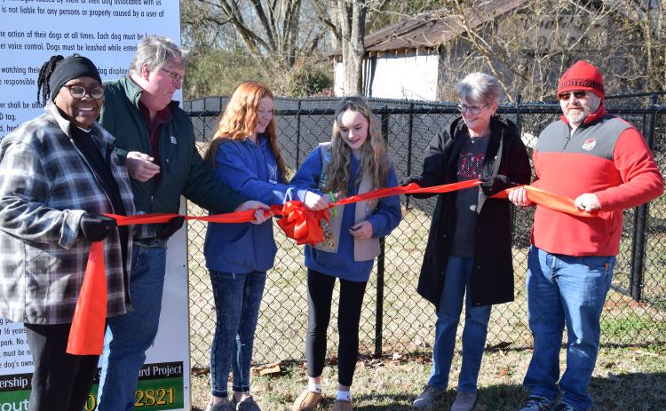 Cutting the ribbon Saturday on the new Paws & Play Dog Park are (from left) former Carnesville Council Member Patsy Watkins, former Mayor Harris Little, Kate Graham, Brooke Tate, Mayor Missy Holbrook and Council Member Wesley Dove.